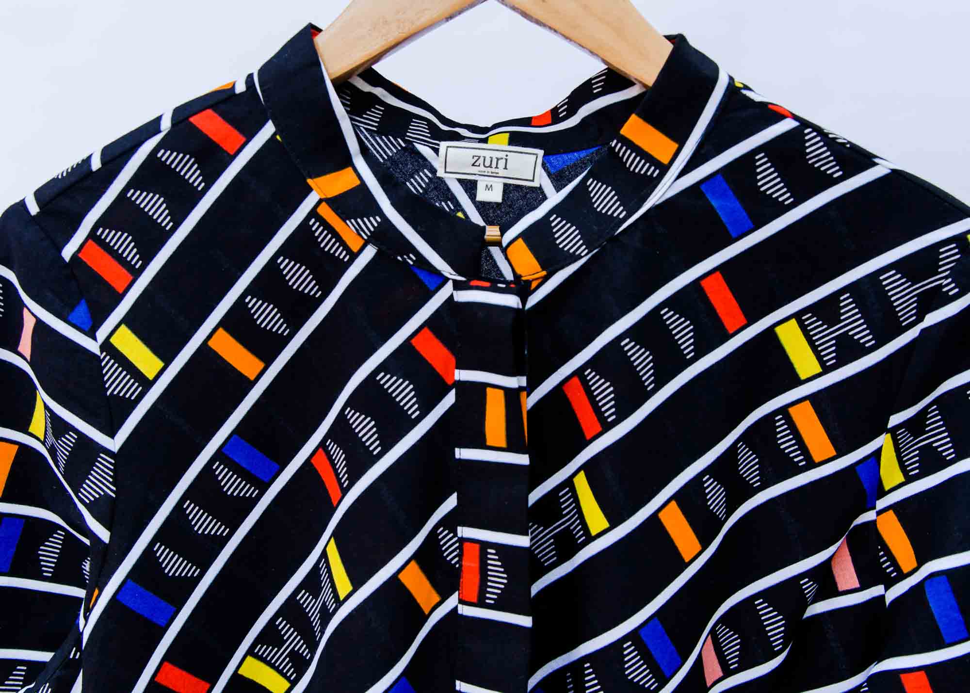 display of a multicolored and black striped dress