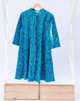 Display of blue squiggle print dress.
