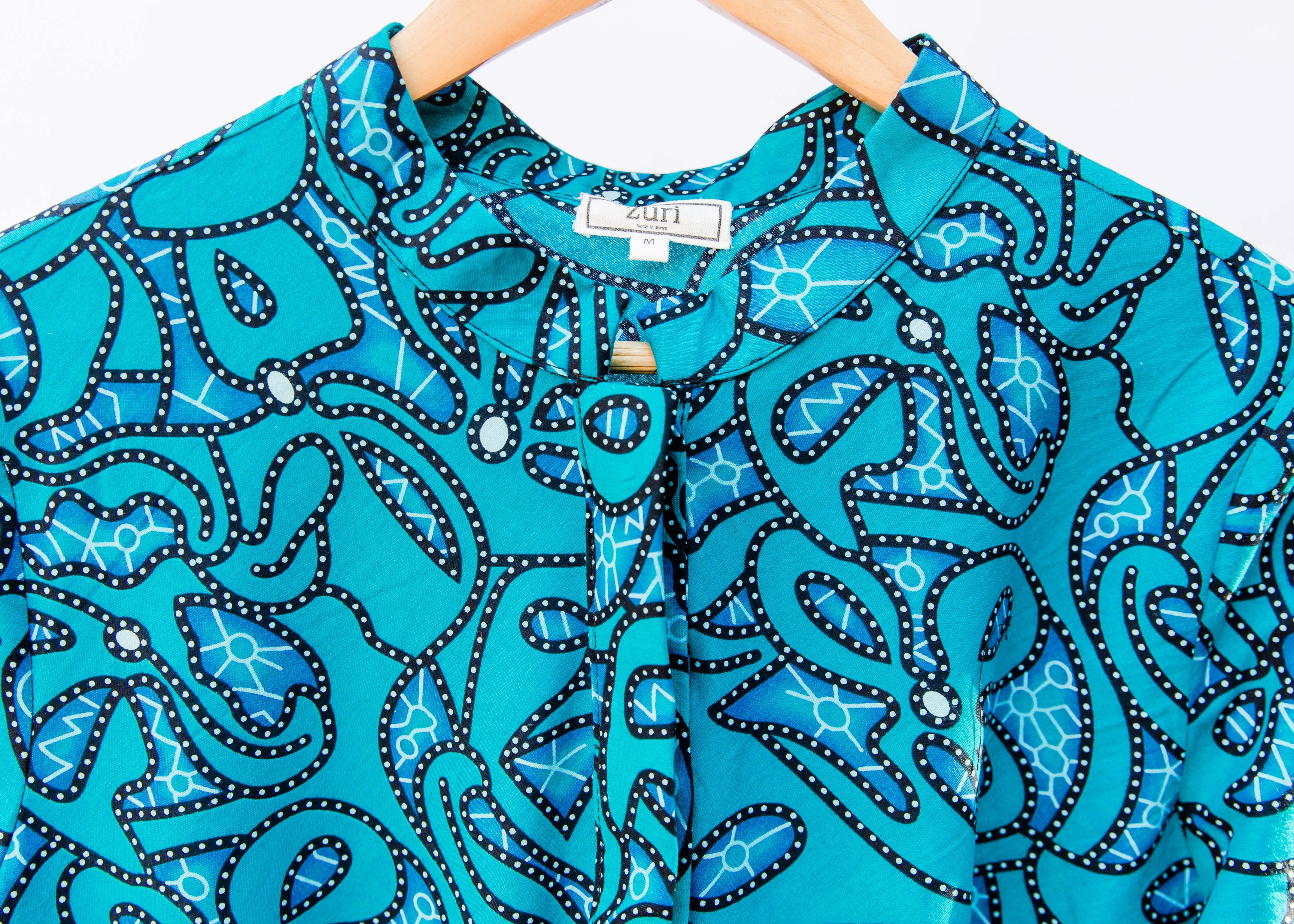 Display of blue squiggle print dress.