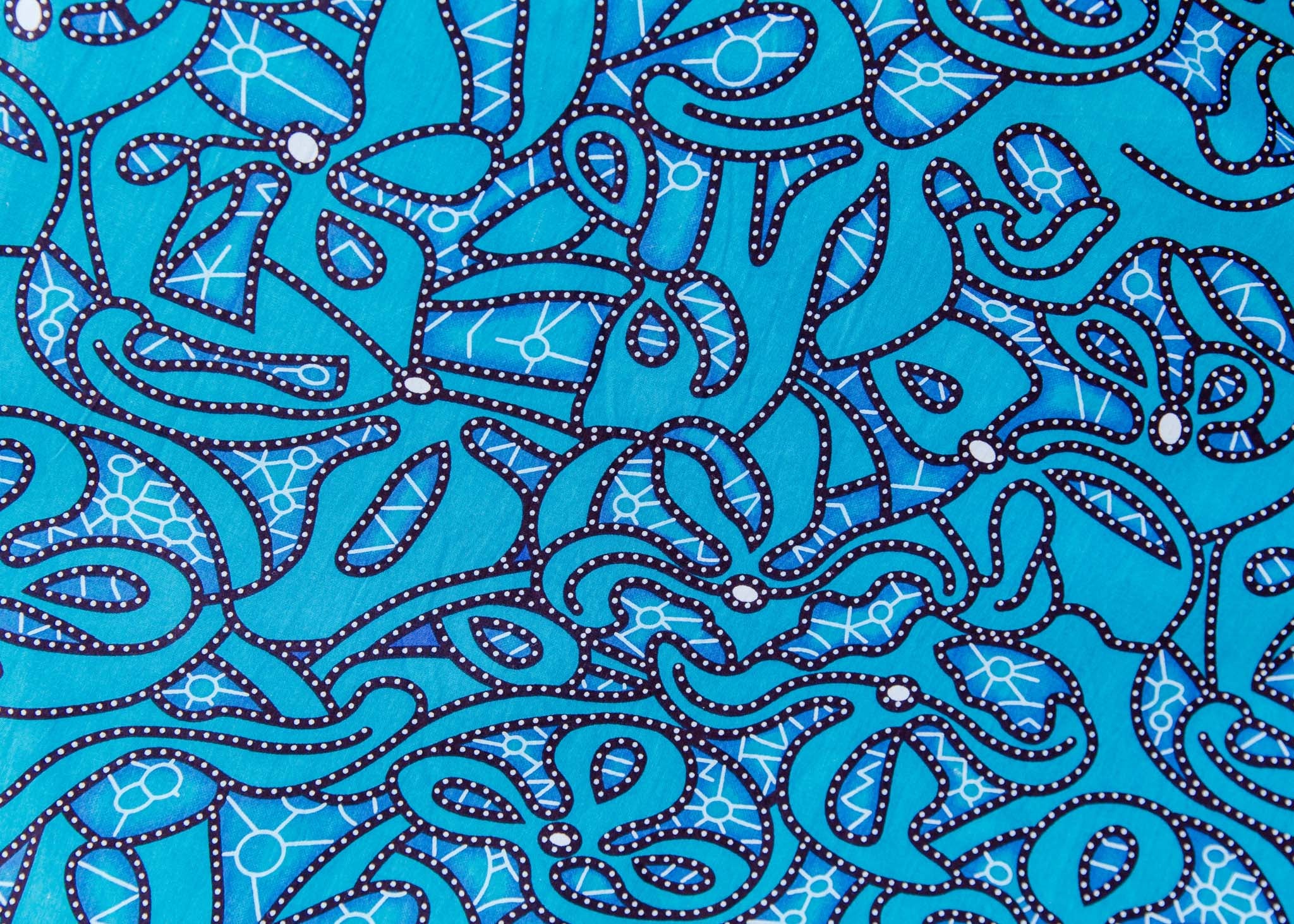 Close up display of blue squiggle print dress, fabric.