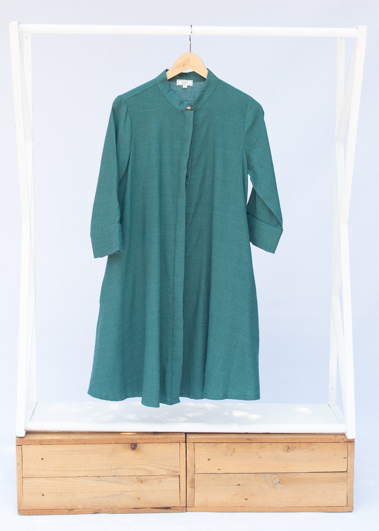 Display of lagoon green linen dress.