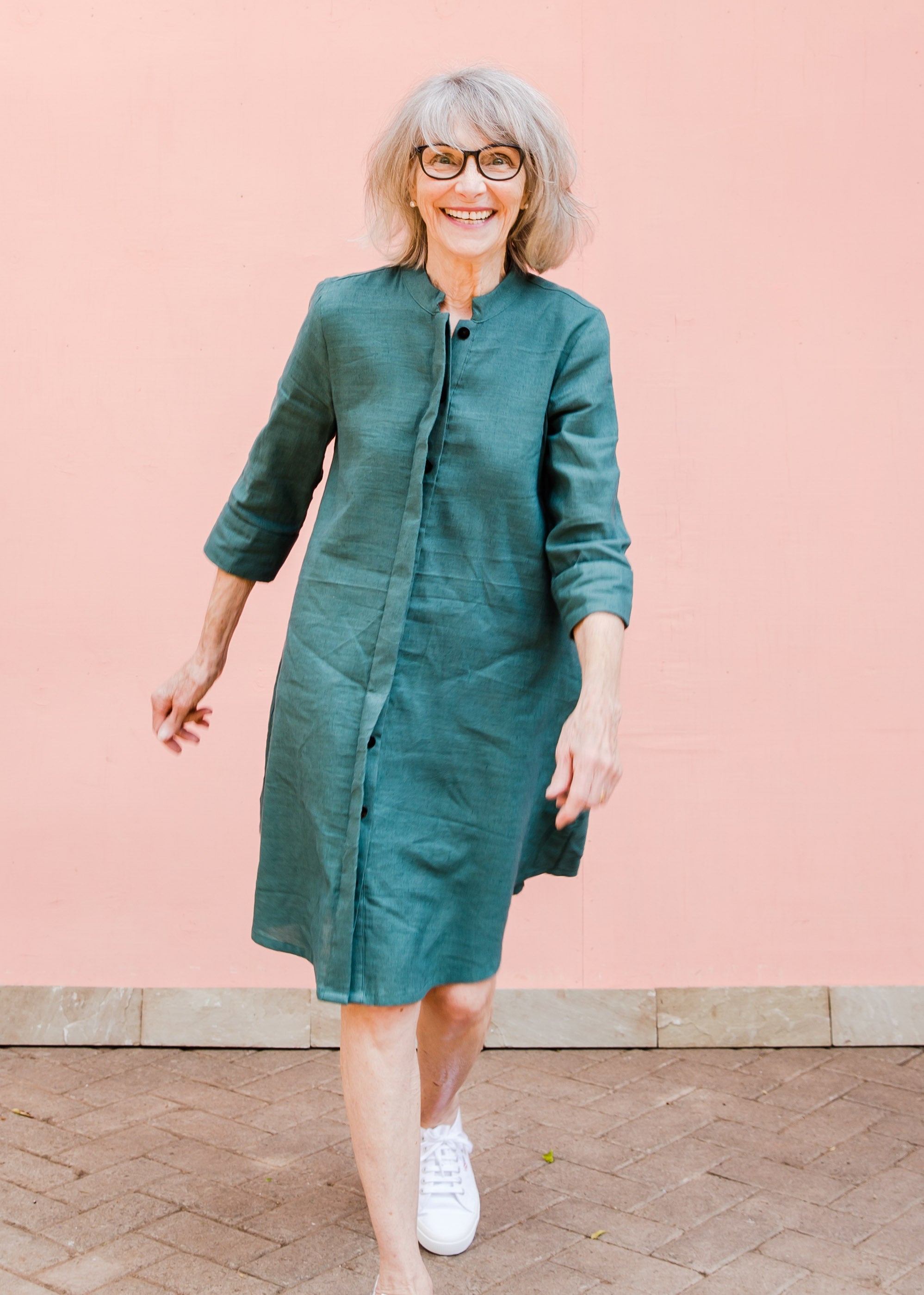 Model wearing lagoon green linen dress.