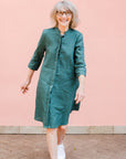 Model wearing lagoon green linen dress.