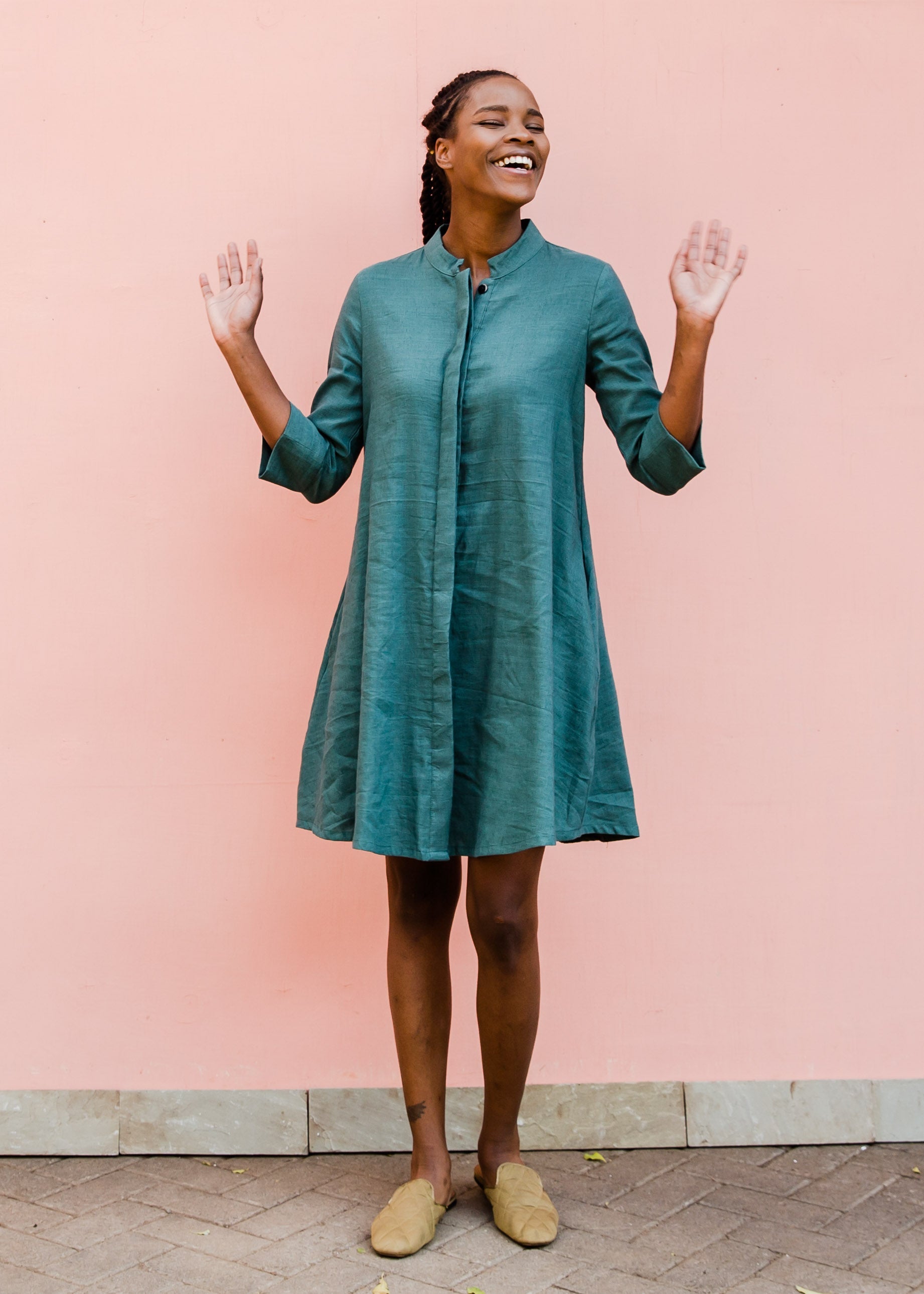 Model wearing lagoon green linen dress.