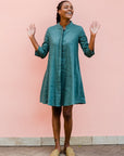 Model wearing lagoon green linen dress.