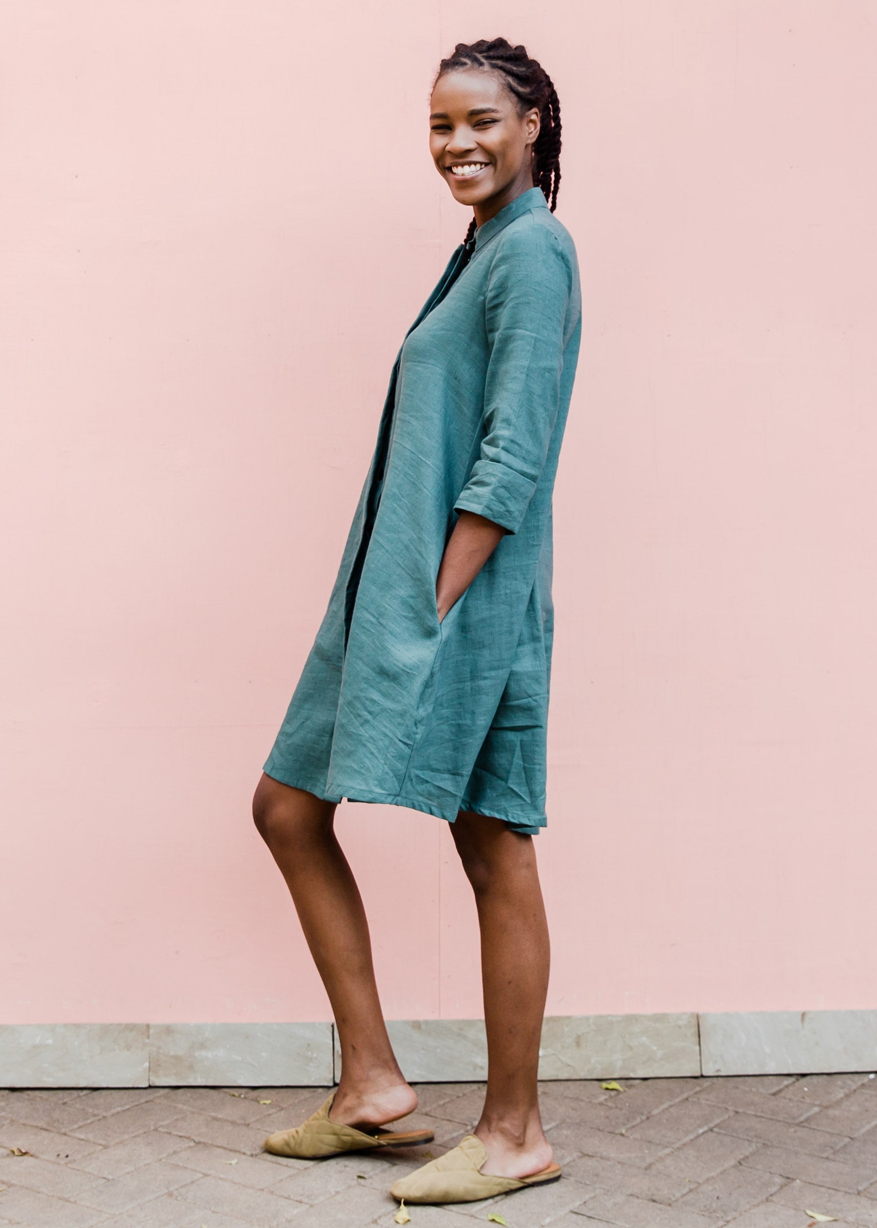Model wearing lagoon green linen dress.