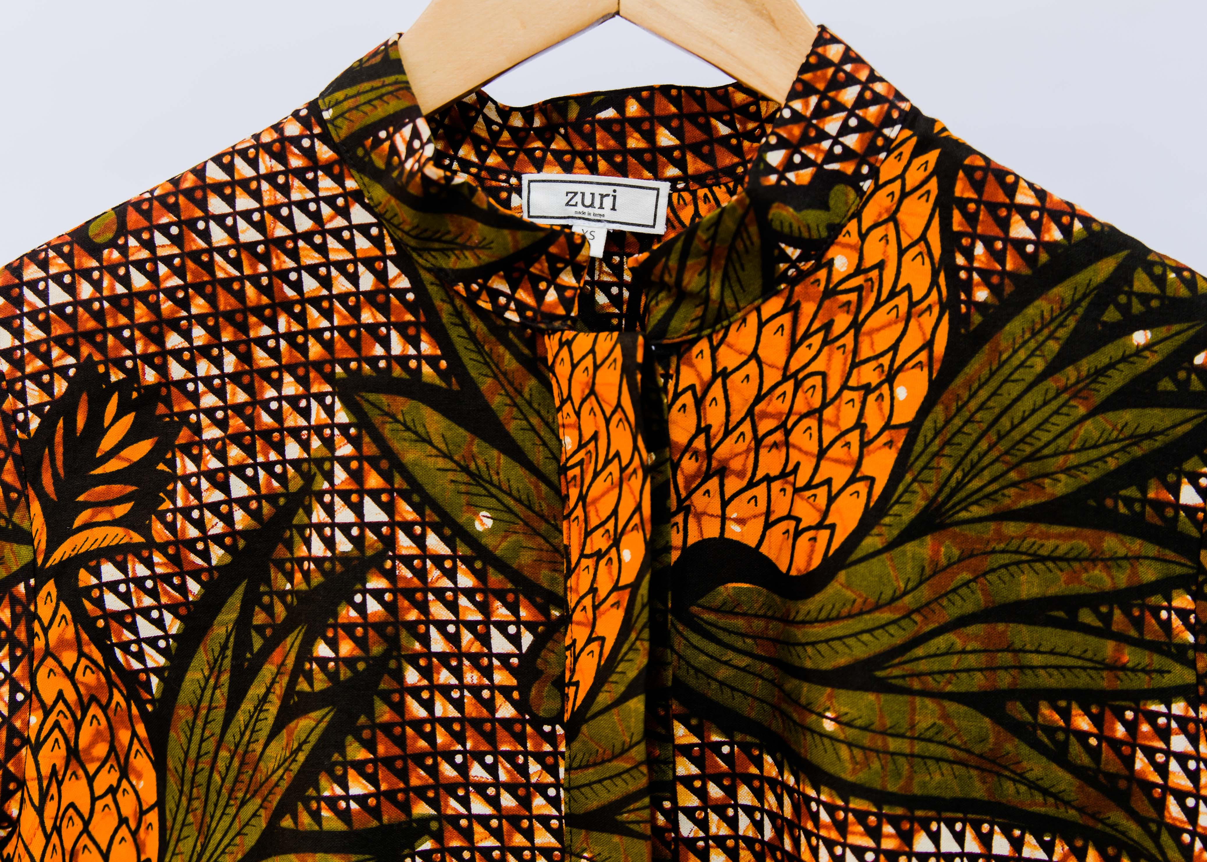 Brown, orange and green pineapple shirt