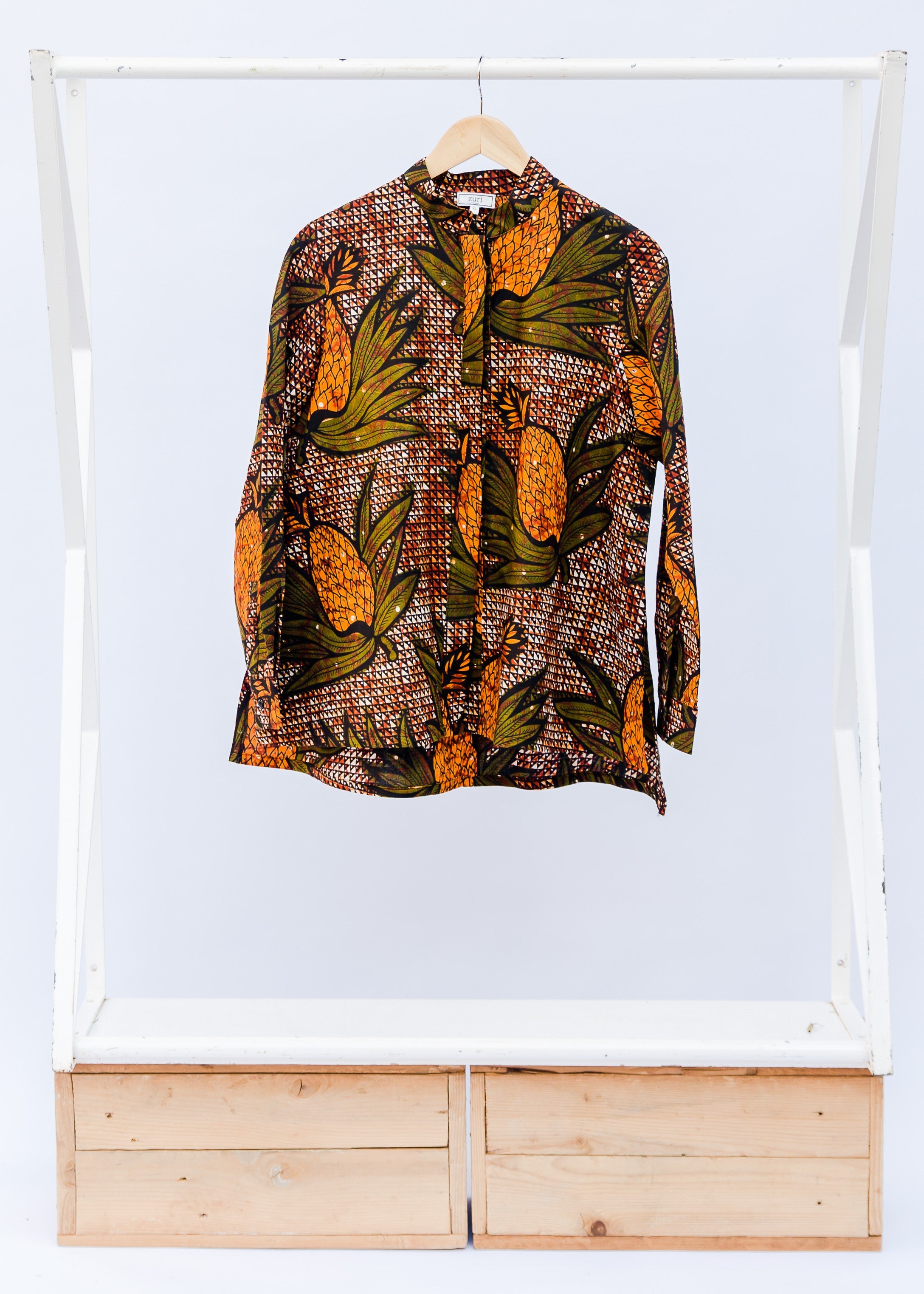 Brown, orange and green pineapple shirt