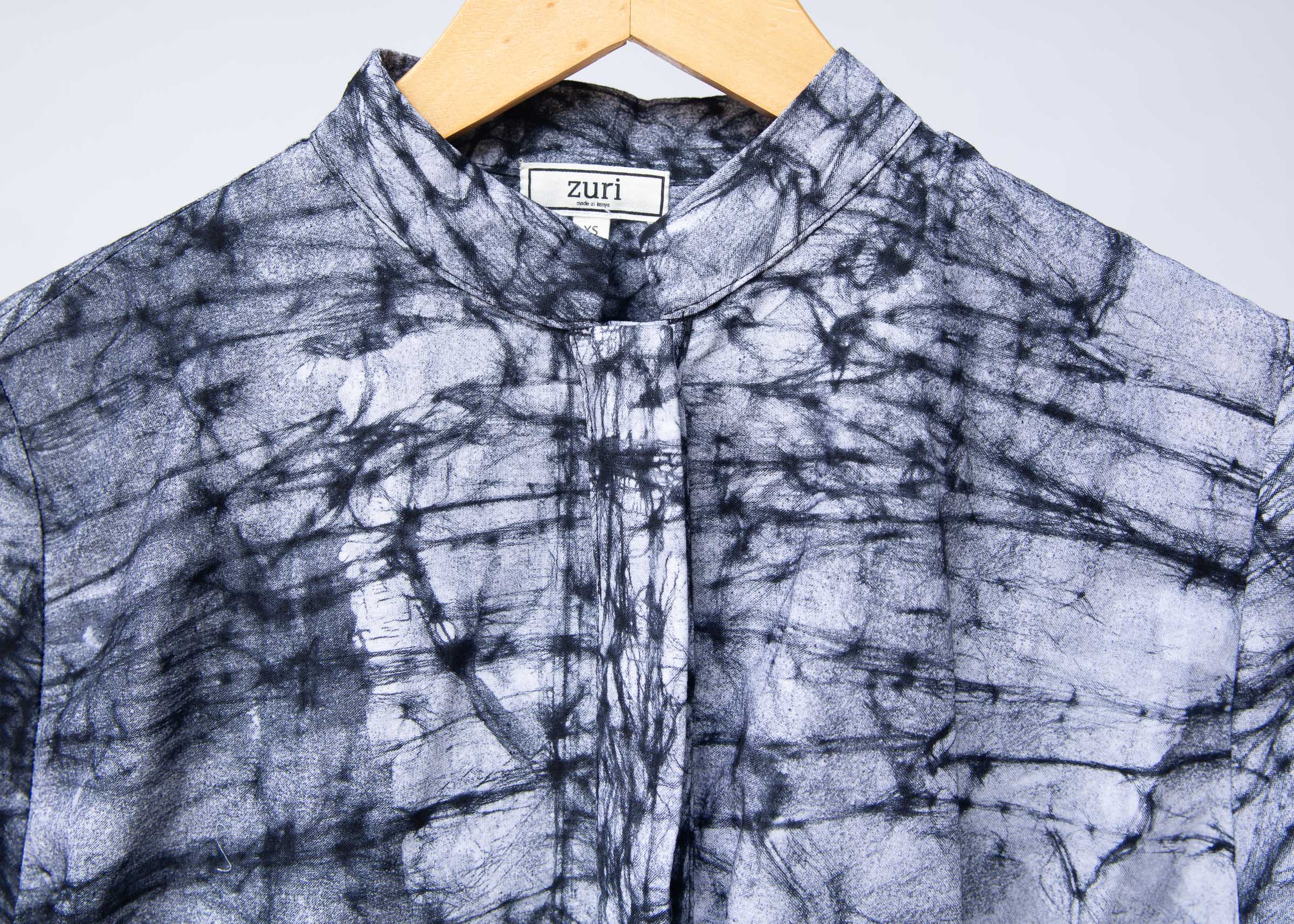 Display of black and white long sleeve batik blouse.