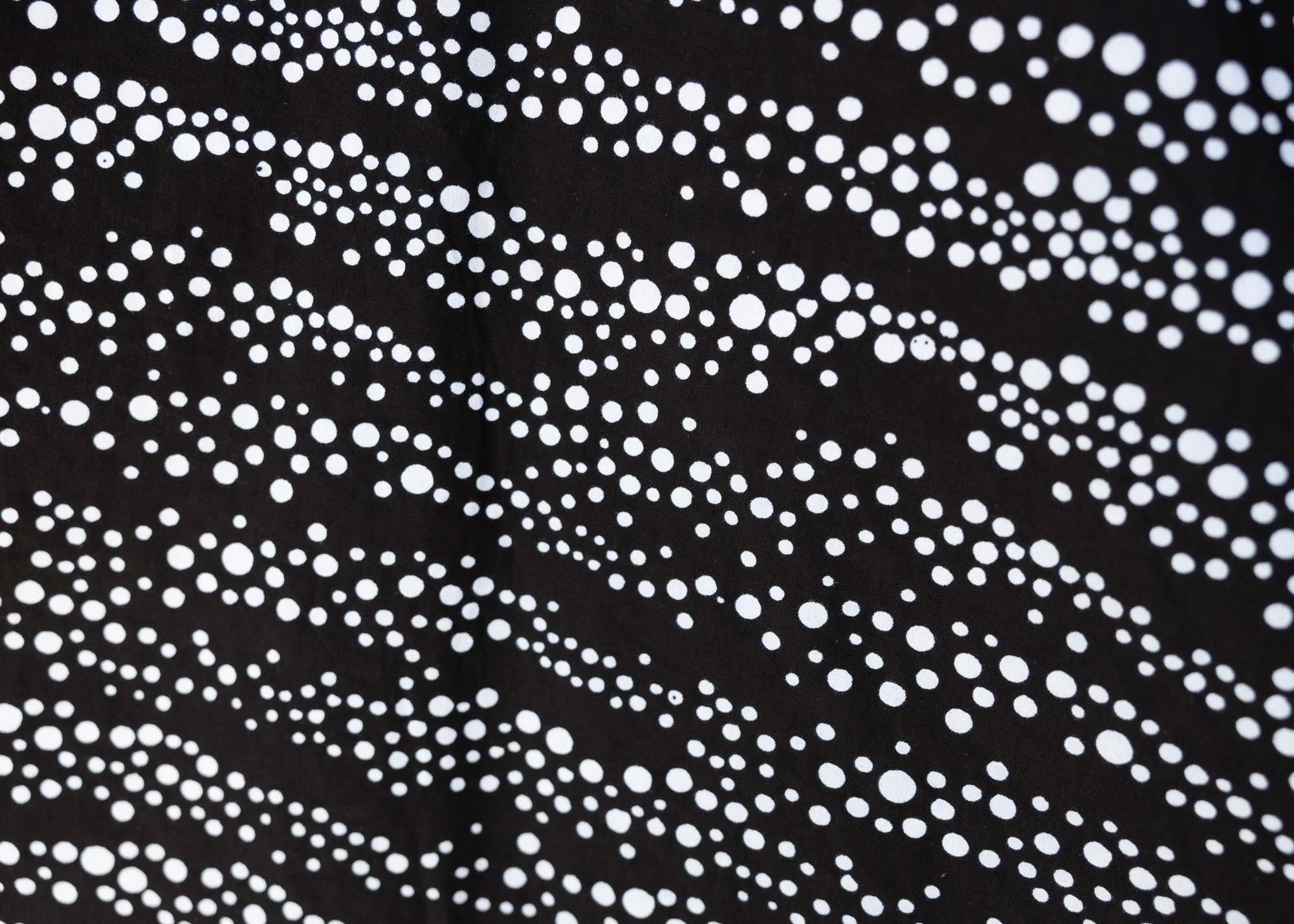 detail of a black and white dress