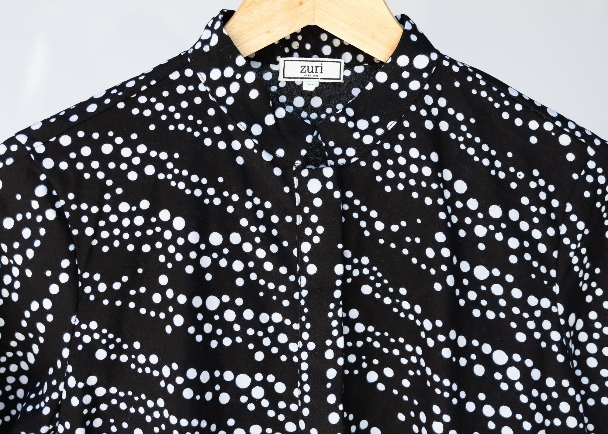 detail of a black and white dress