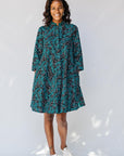 model wearing teal printed shirt dress