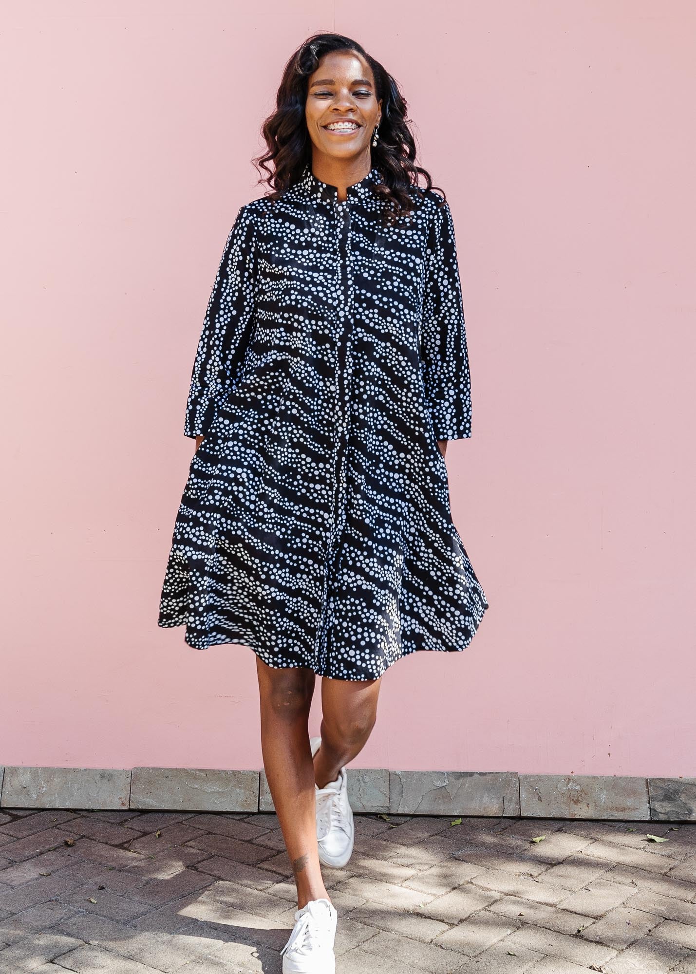 model wearing a black and white dress