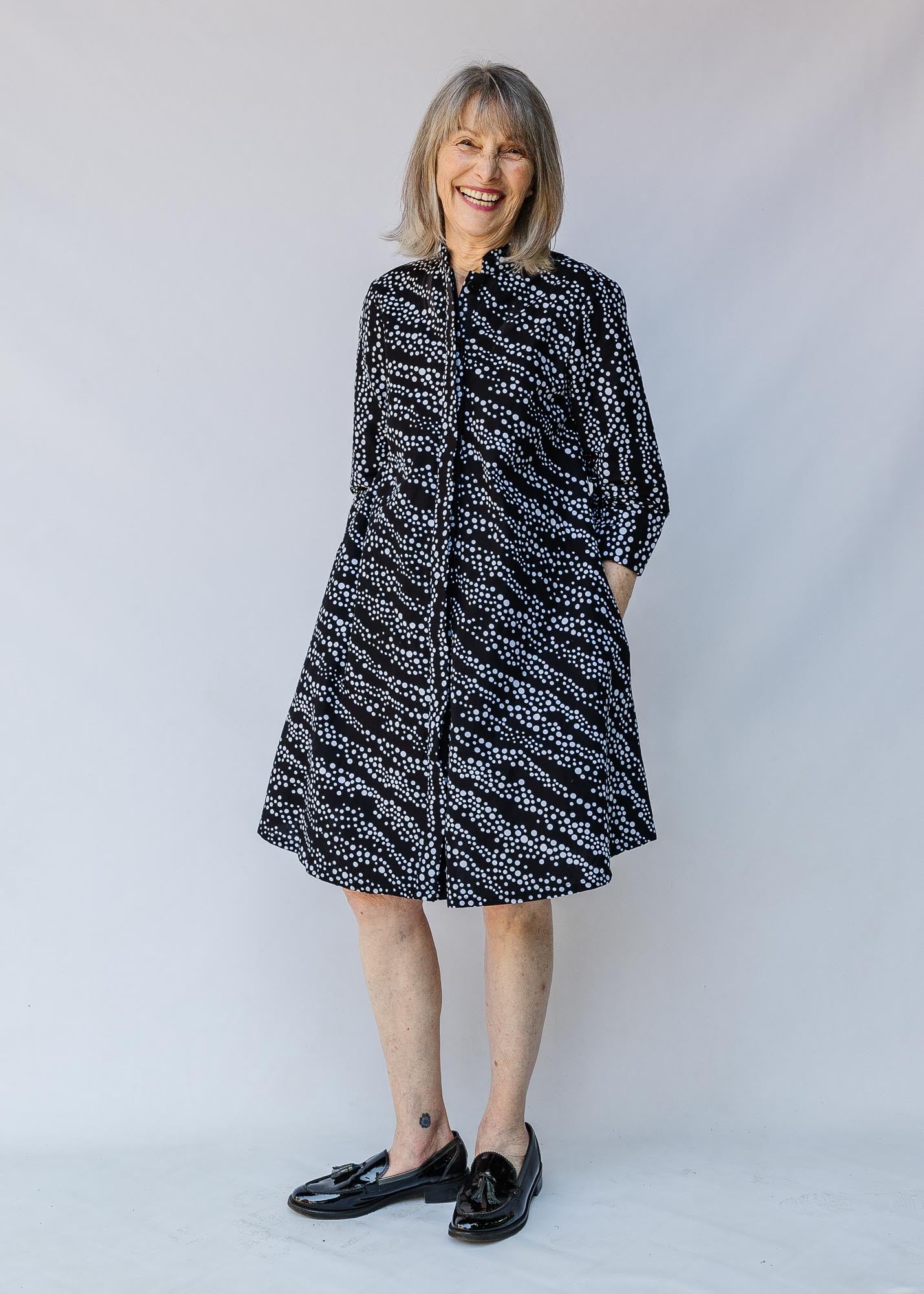 model wearing a black and white dress