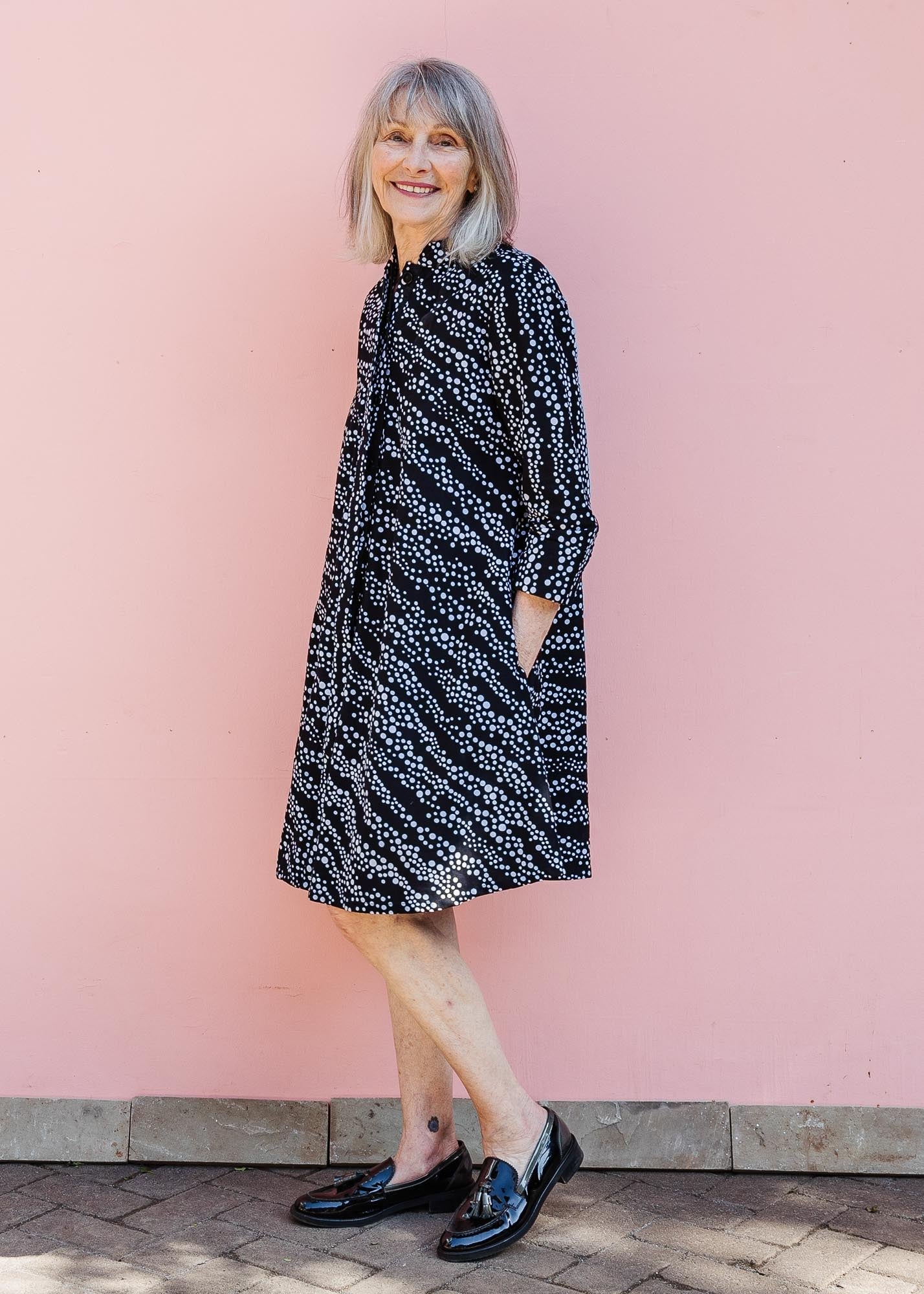 model wearing a black and white dress