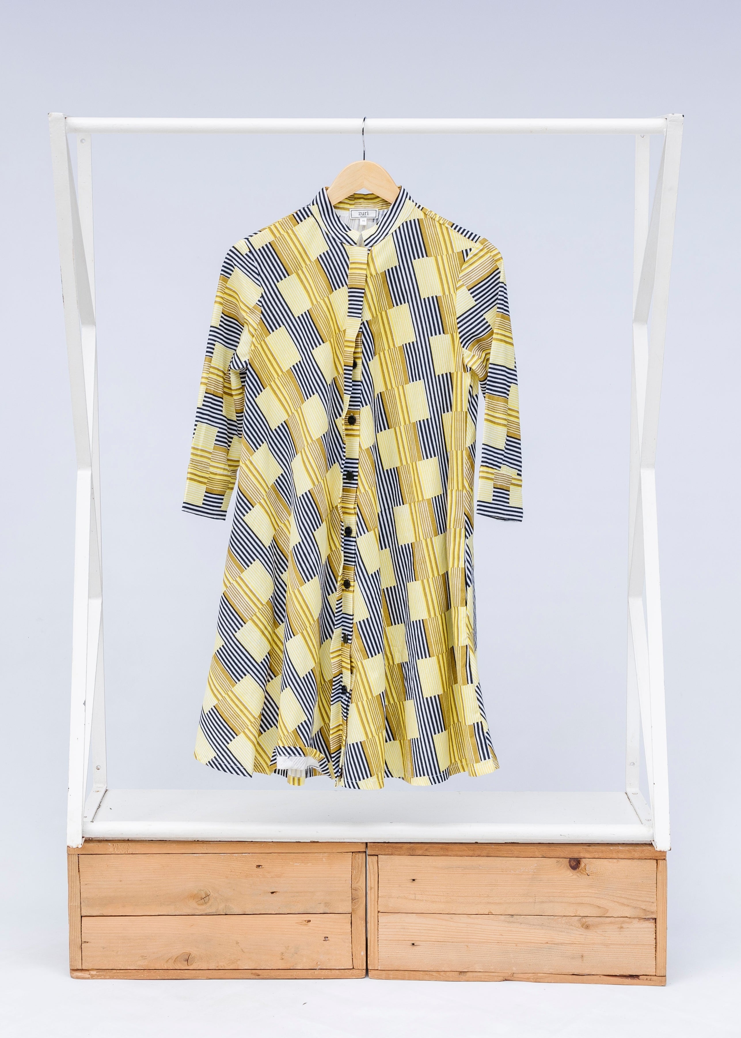 Display of yellow and black striped dress.