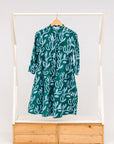 Display of green and blue floral batik dress. 