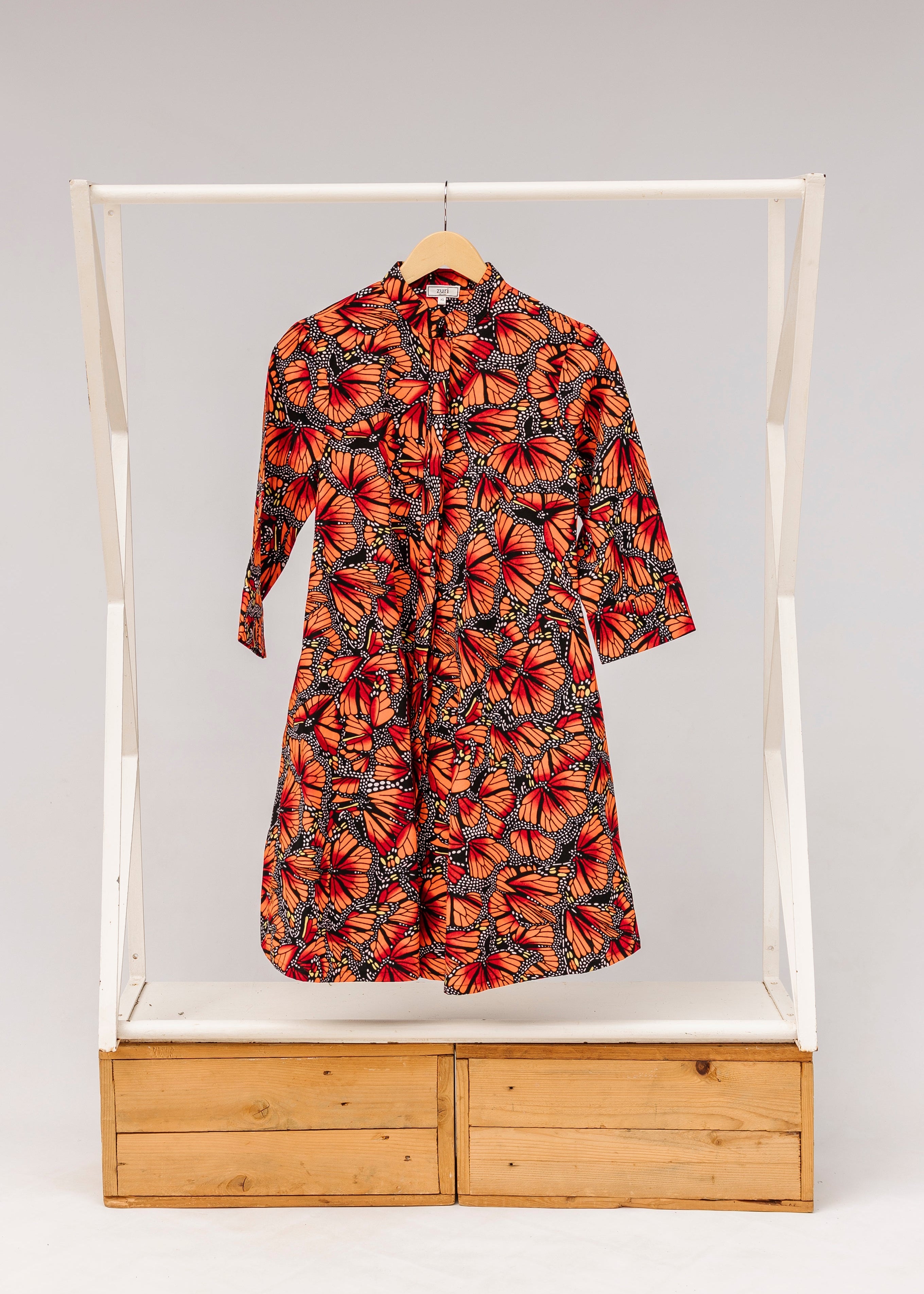 Display of butterfly print dress.