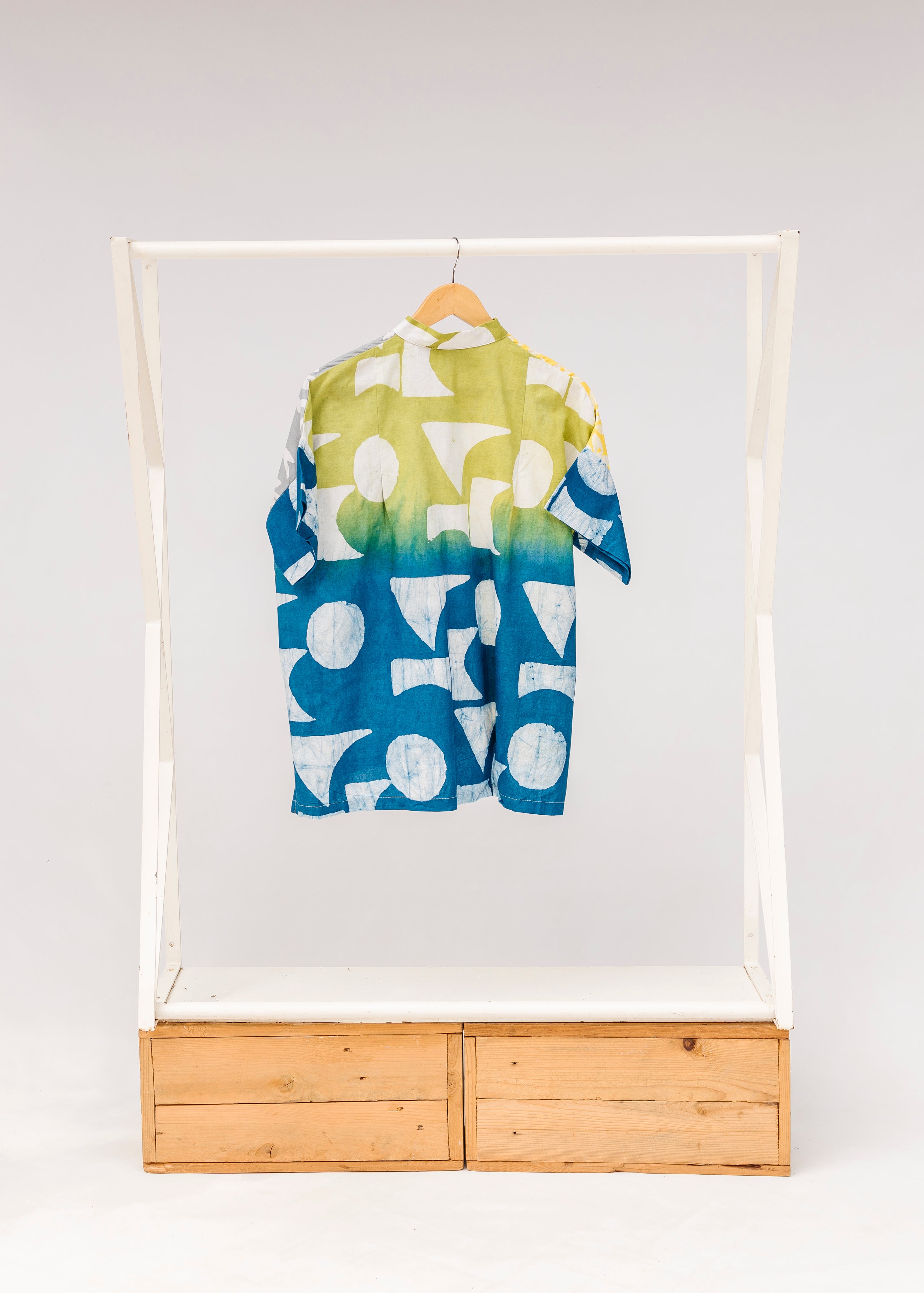 Display of mutlicolored batik shortsleeved shirt.