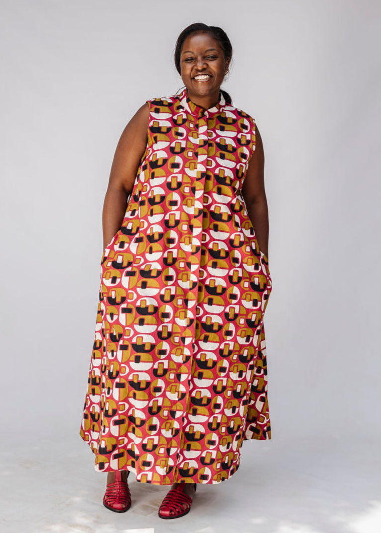 Model wearing geometric print dress.