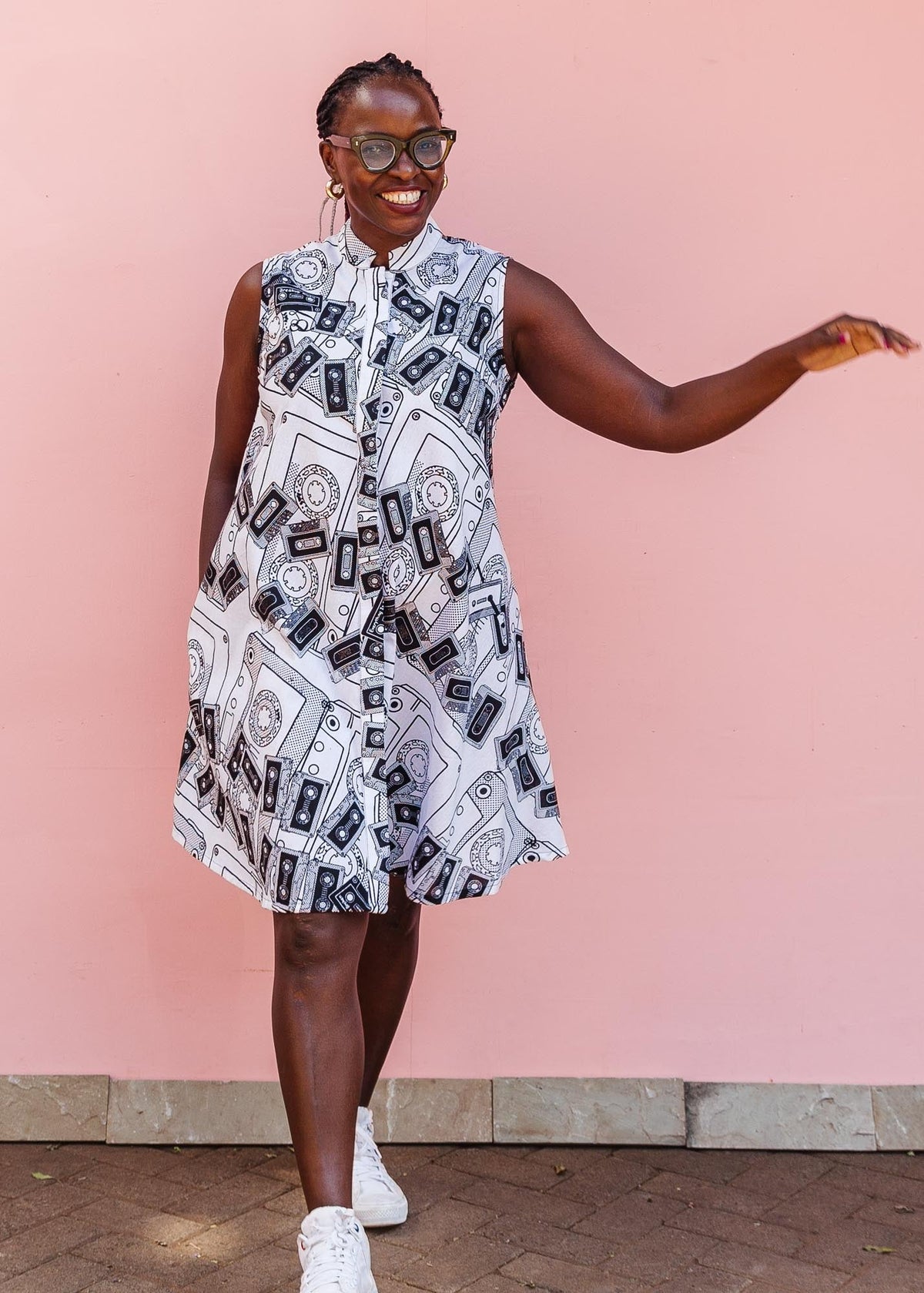 The model is wearing black and white pictorial print with tapes 