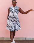 The model is wearing black and white pictorial print with tapes 