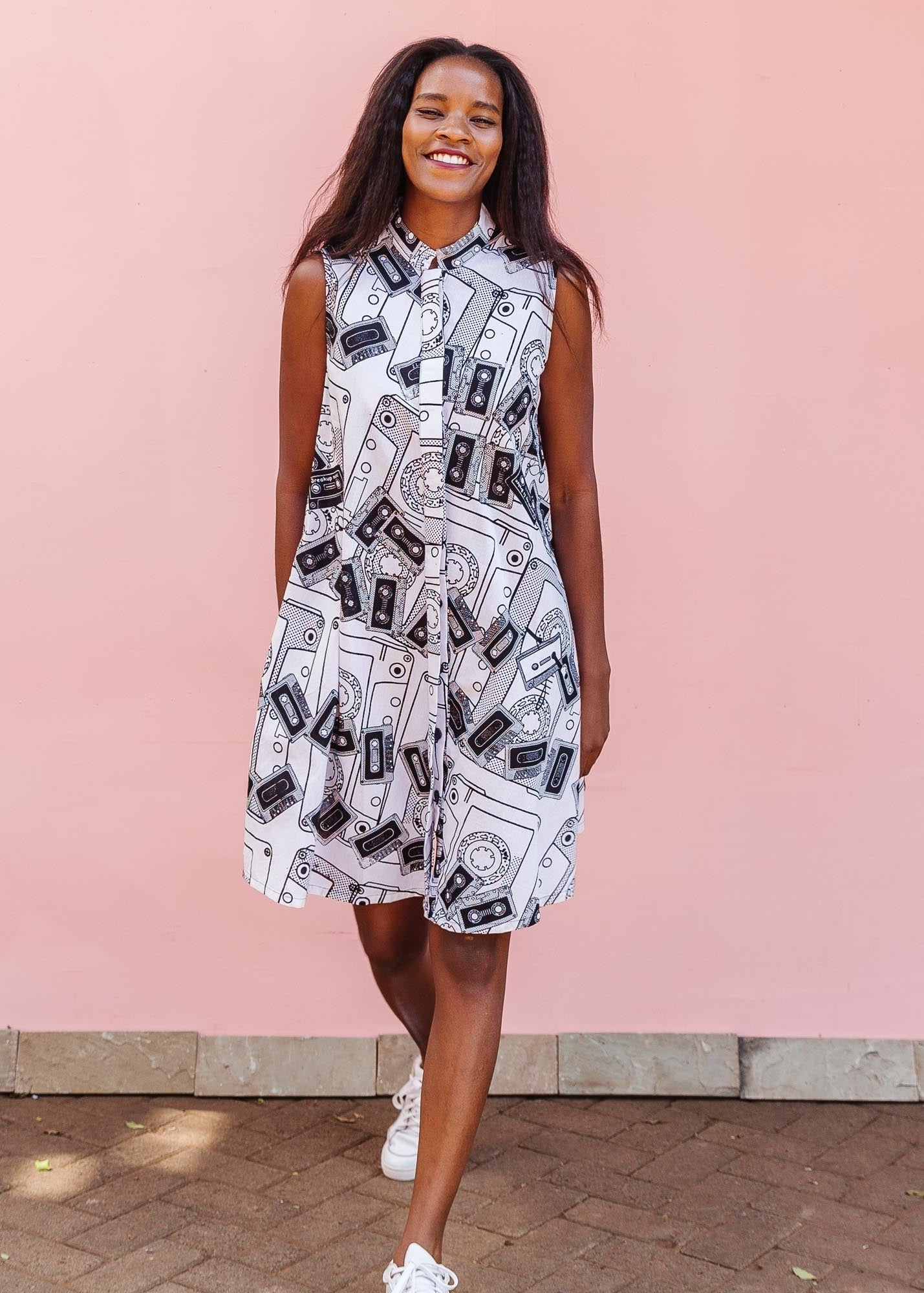 The model is wearing black and white pictorial print with tapes 