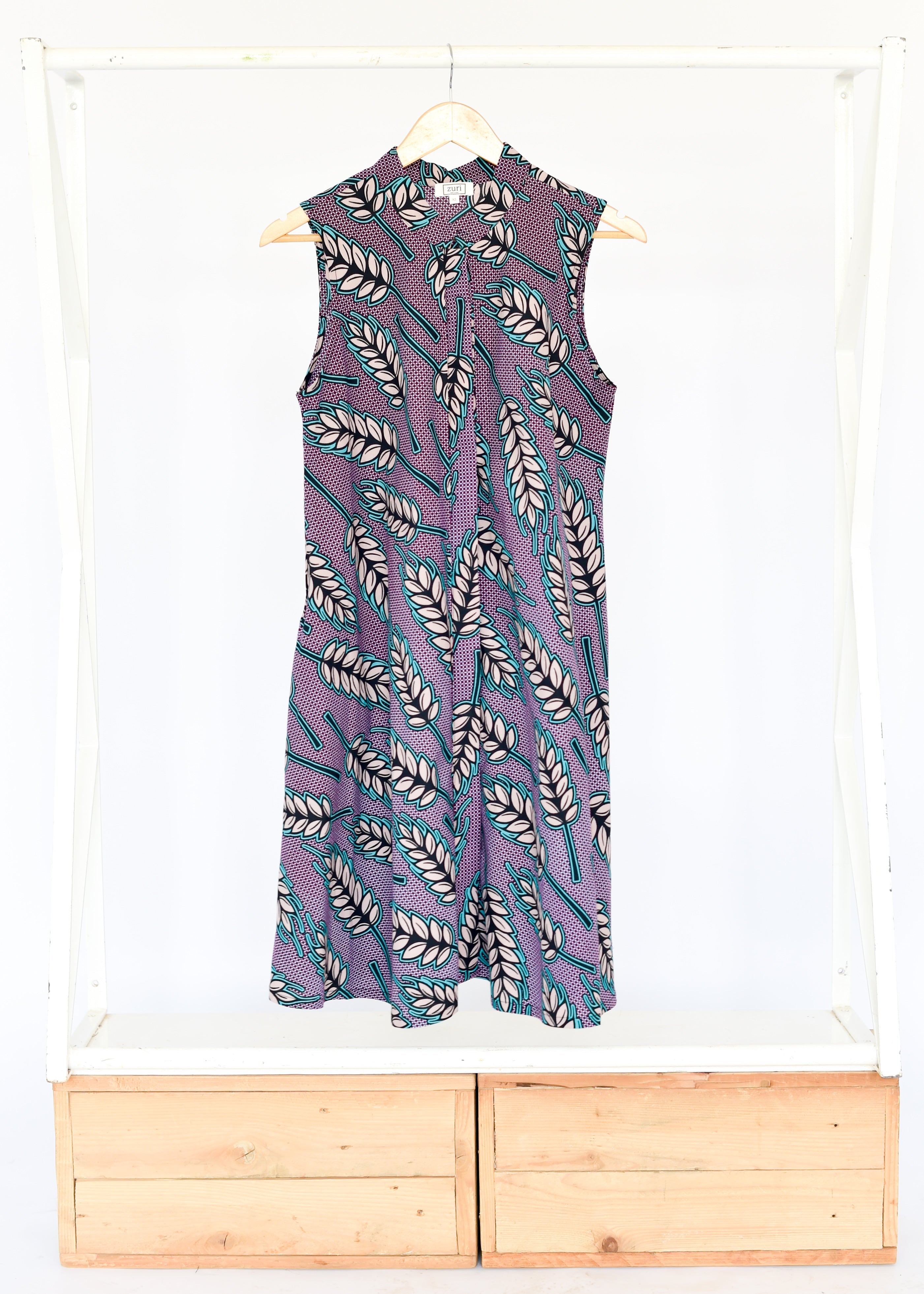 Display of purple dress with wheat print.