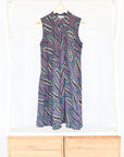 Display of purple dress with wheat print.