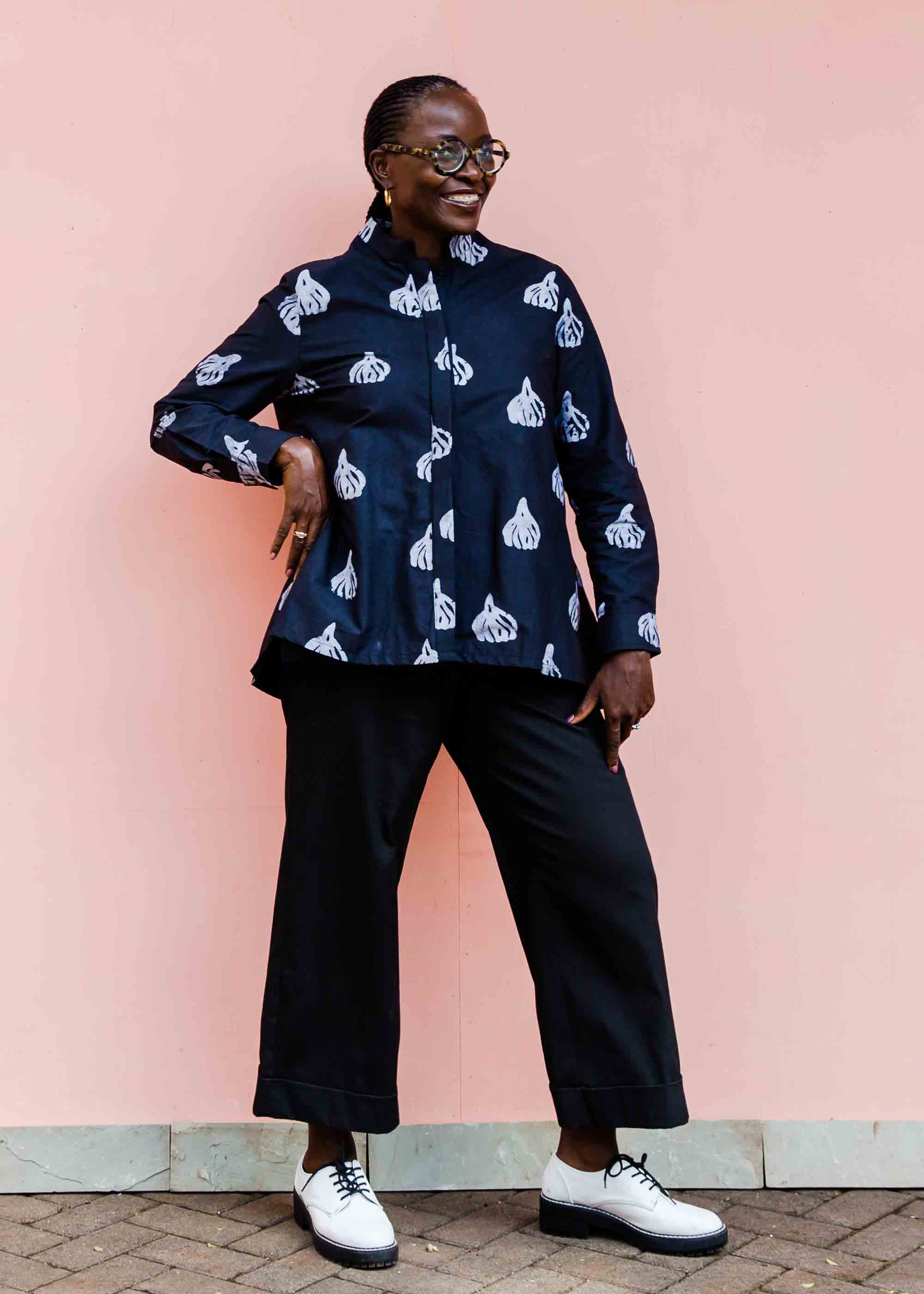 model wearing a black and white garlic design shirt