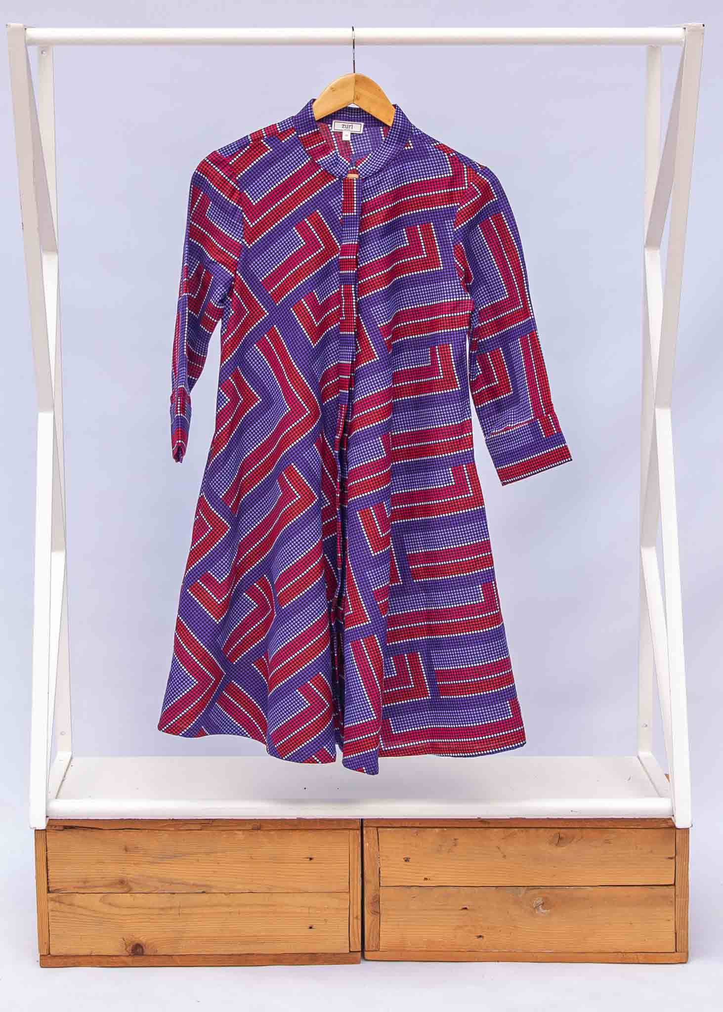 a blue, red and lavender geometric shirt dress