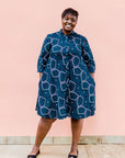 Navy background with blue, green and white dress