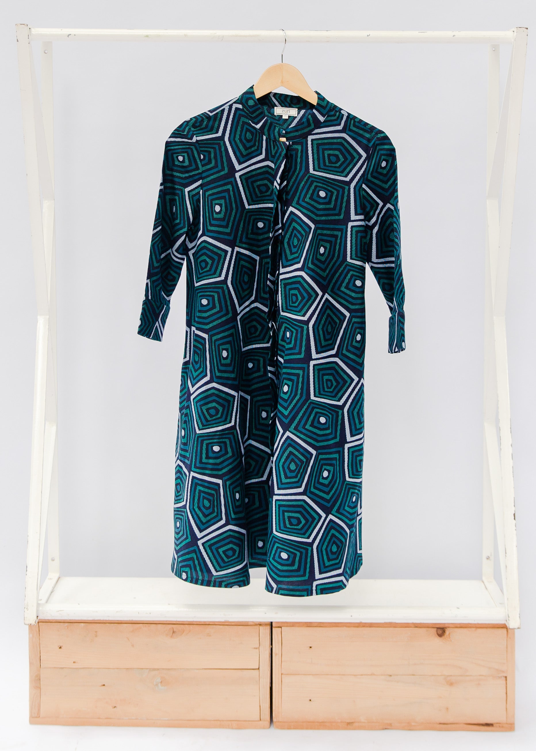 Navy background with blue, green and white dress