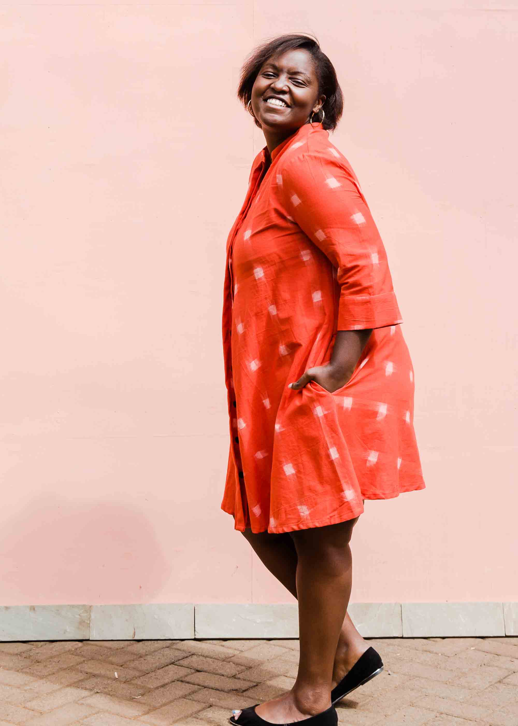 model wearing a red ikat dress