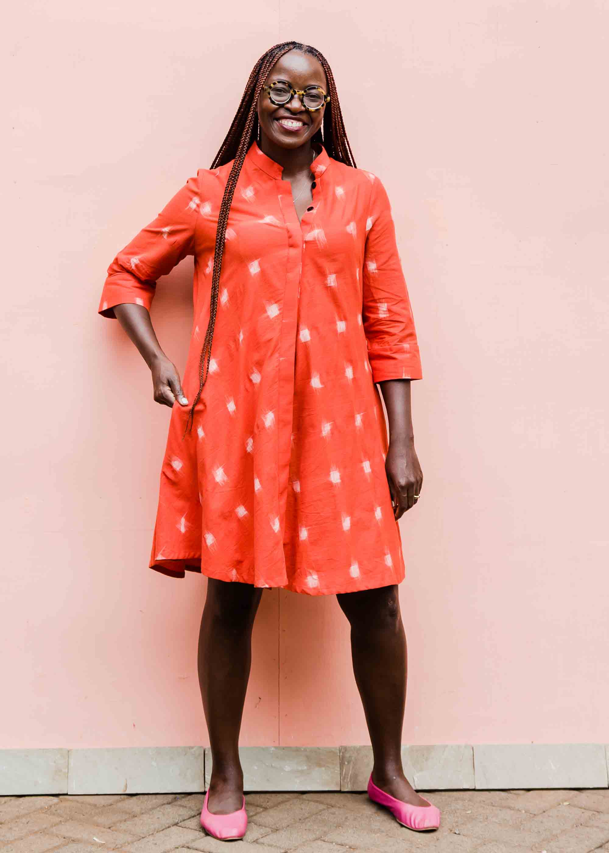 model wearing a red ikat dress