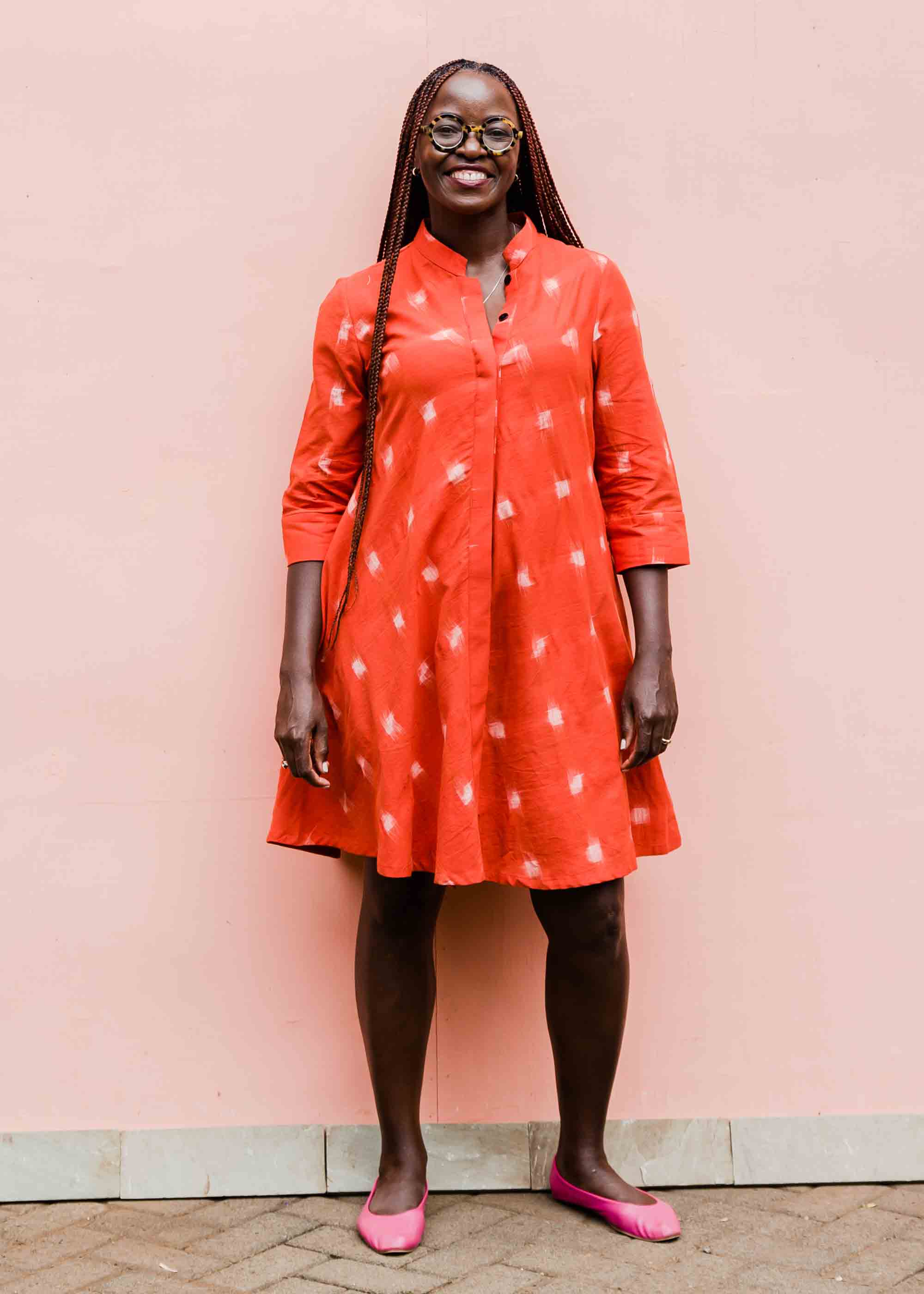 model wearing a red ikat dress