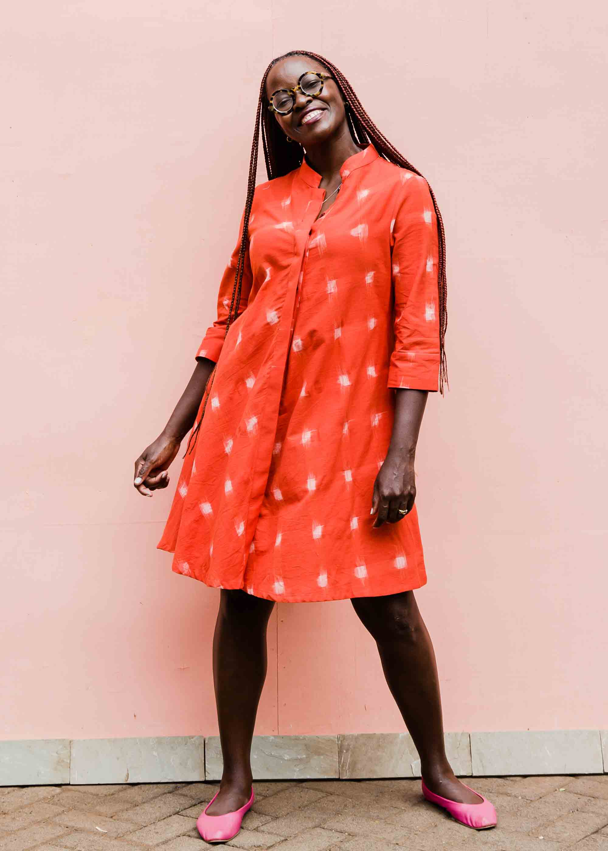 model wearing a red ikat dress