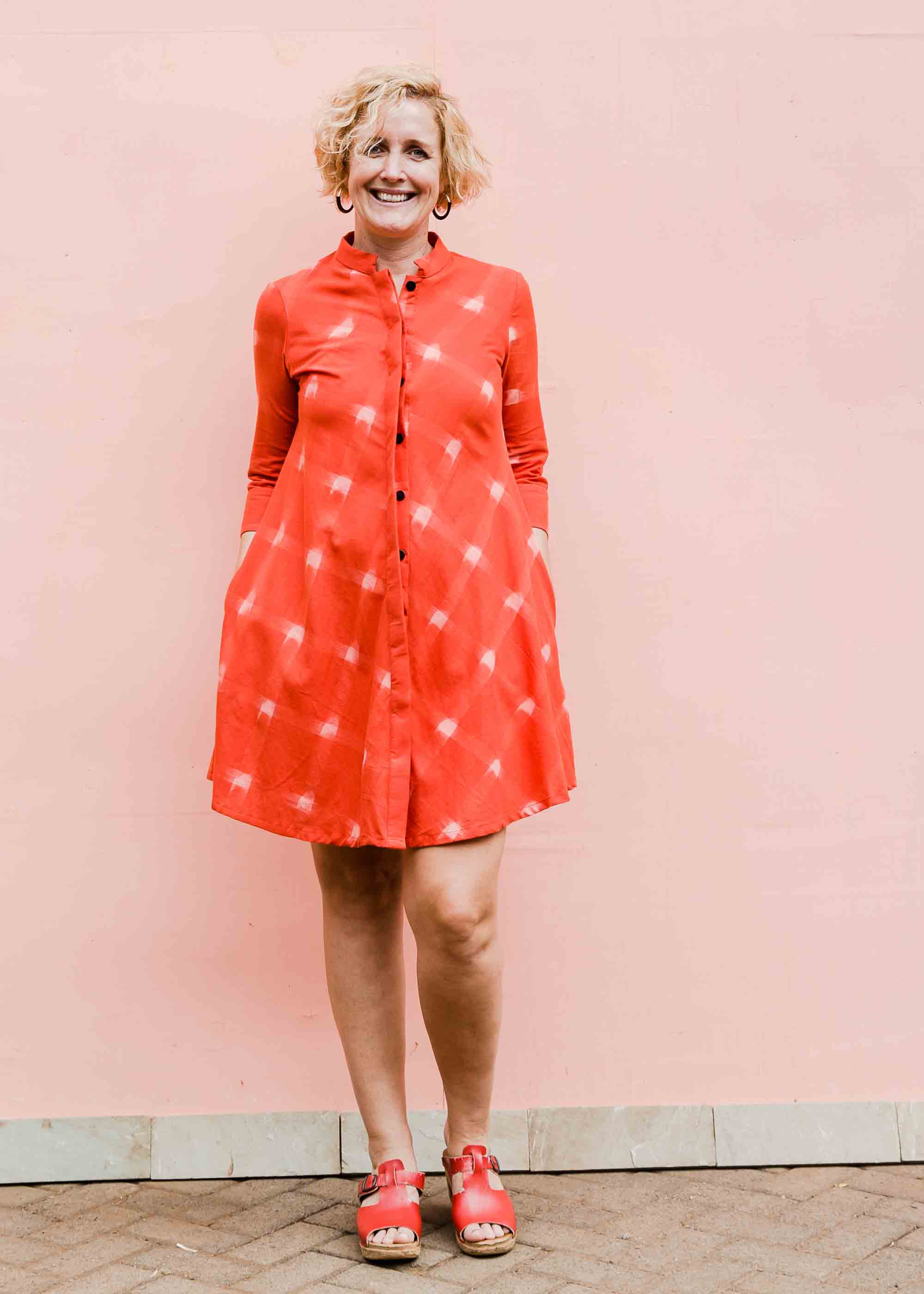 model wearing a red ikat dress